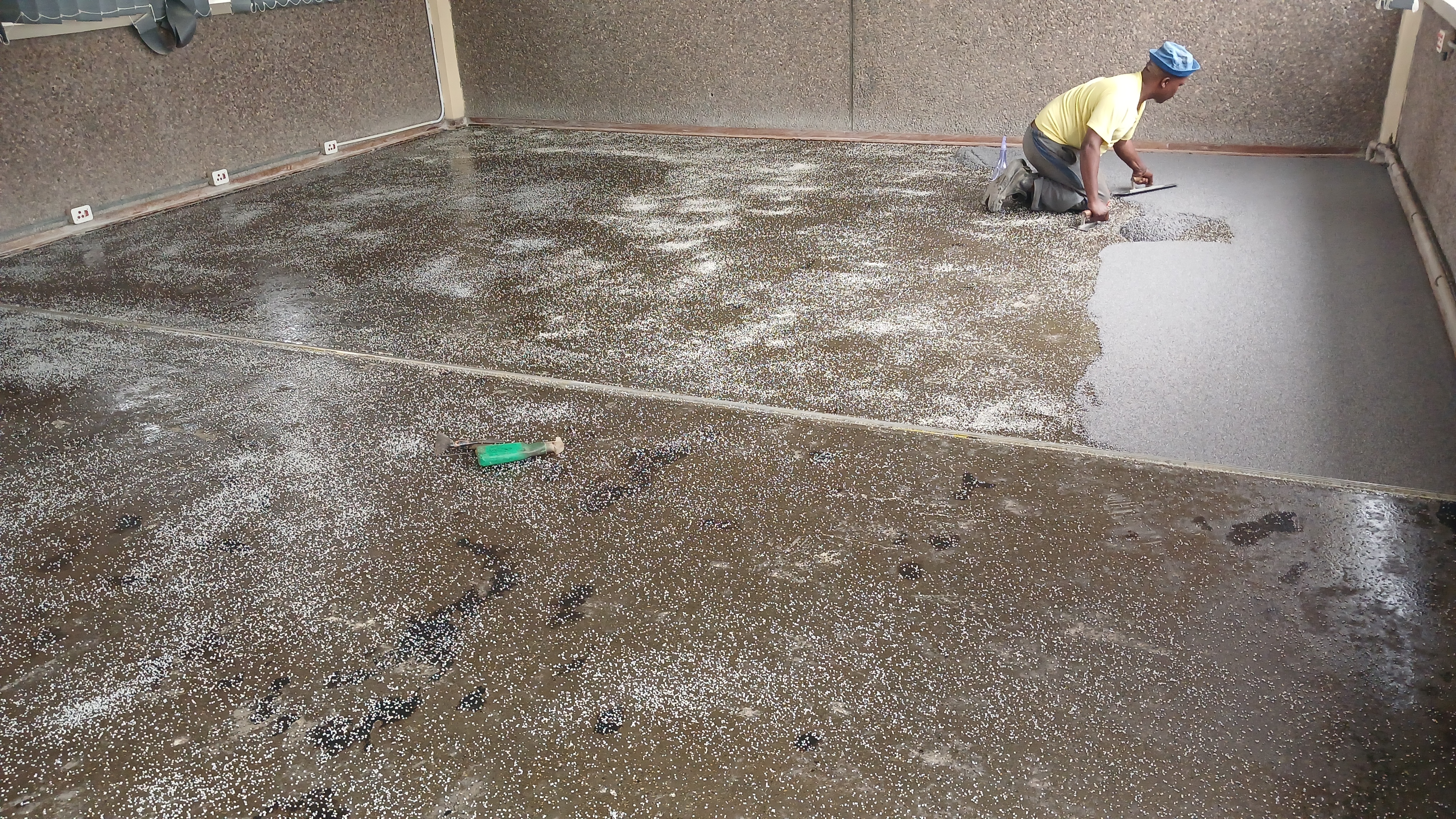 Concrete floor fully primed and ready for quartz carpet installation