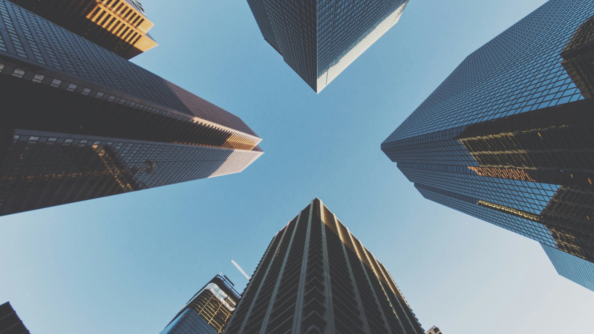 Skyscrapers looking up into the blue sky